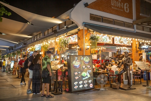 Unidentified people at the restaurant at the Asiatique The Riverfront in Bangkok, Thailand