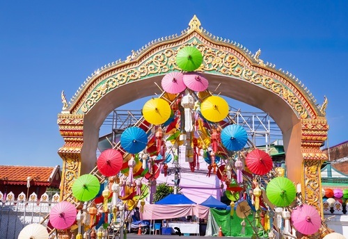 Bo Sang Craft village presenting umbrellas in its gate, near Chiang Mai, Thailand