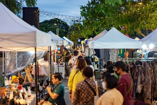 Crowded evening outdoor street market | Travel with Joy