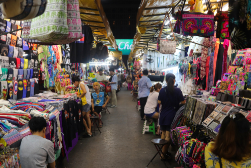 Shoppers browse the various stores at the Patpong night market, Bangkok, Thailand