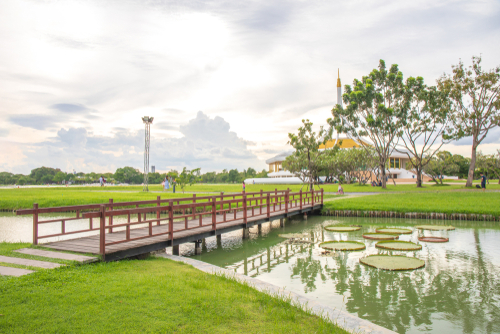 Wooden bridge at Ratchamangkhala Pavilion at public park name Suan Luang Rama IX on sunset time Bangkok, Thailand