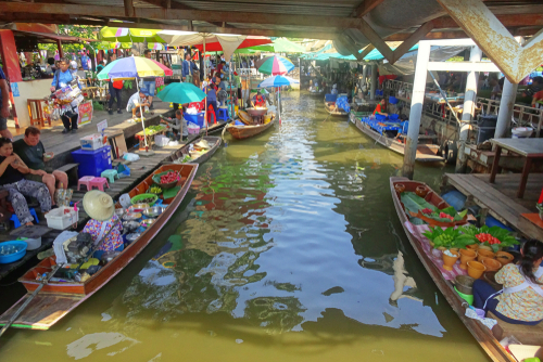 Floating Market Taling Chan, lls selling food on rafts, fresh fruits and vegetables in a genuine atmosphere on the riverside, Bangkok, Thailand