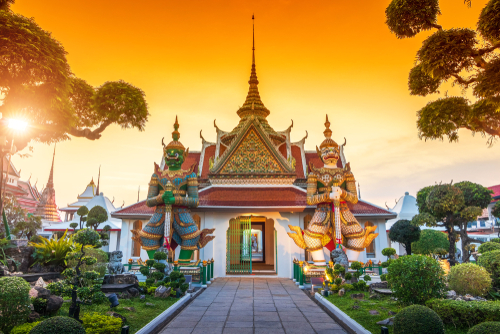 Giants front of the church at Wat Arun. Wat Arun is a Buddhist temple in Bangkok Yai district of Bangkok, Thailand. Wat Arun Temple at sunset in bangkok