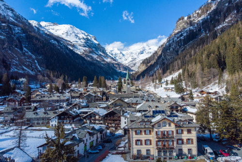 Aosta Valley, Italy. Chapel in Gressoney-Saint-Jean. View of alpine village Monte Rosa Gressoney, Aosta Valley Italy covered by snow in a cold winter season. Aerial view Alpine Village. Alps Landscape