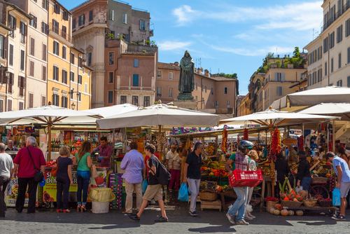 Field of Flowers in one of the main squares of Rome, lively both day, market, and at night, when the terraces are filled with tourists in Campo di Fiori in Rome, Lazio, Italy