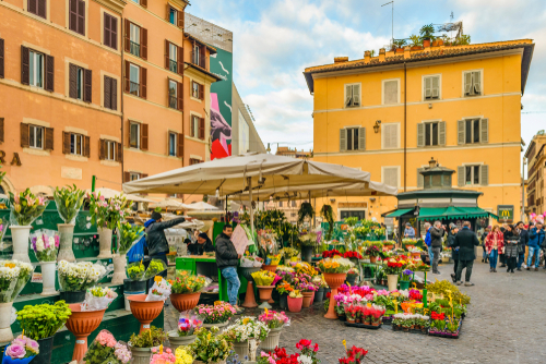 View of a beautiful and colorful stall with flowers in Campo di Fiori, a traditional street market at the historic center of Rome, Lazio, Italy