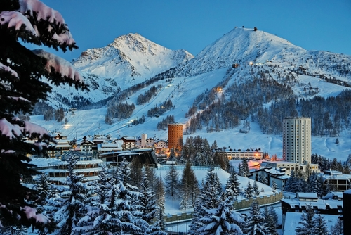 Overview of the snow-covered alpine village of Sestriere, which was the site of the Winter Olympics in 2006. Sestriere, Piedmont, Italy