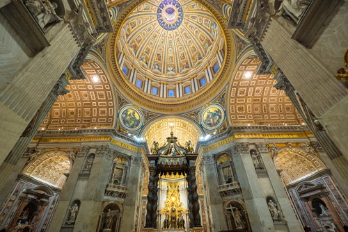 Architectural details of the Dome (Cupola) and Bernini's Baldacchino (baldachin or canopy), the Apse with St. Peter's Cathedra in St. Peter's Basilica in Rome, Lazio, Italy