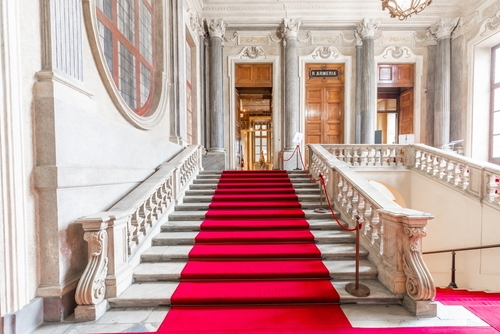 Red carpet in Royal Palace, luxury elegant marble stairway, Turin, Piedmont, Italy