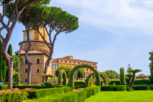 Alleys of French Garden section of the Vatican Gardens in the Vatican City State with Vatican Radio broadcasting tower in the background, Rome, Lazio, Italy