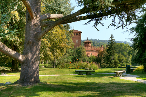 Medieval Castle among trees at botanical garden located at Valentino Park (Parco del Valentino) in Turin, Piedmont, Northern Italy