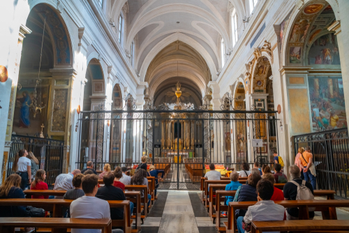 Interior view of Trinita dei Monti Church and its congregation in Rome, Lazio, Italy