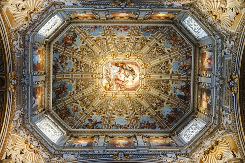 Interior view of the ceiling at the Basilica di Santa Maria Maggiore (Saint Mary Major). The Cathedral is Romanesque architecture with a gilded interior hung with tapestries, built in 1137, located in Bergamo, Lombardy, Italy