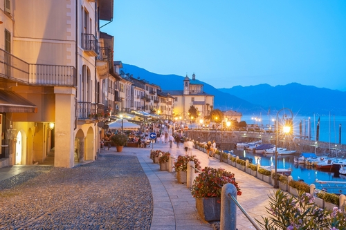 Cannobio, Lombardy, Italy. Waterfront promenade with historic house facades in Cannobio. Cannobio is a town on the shore of Lake Maggiore