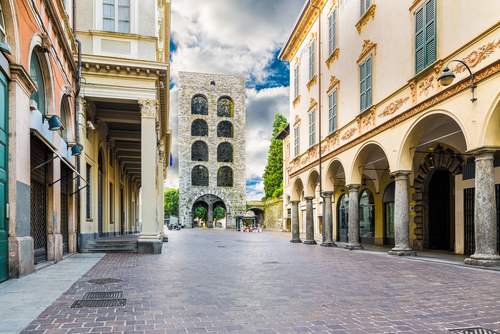 Como city, historic center, lake Como, Lombardy, Italy. Medieval tower (12th century), called Porta Torre and via Cantù