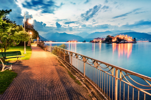 Splendid evening cityscape of Stresa town. Wonderful summer susnset on Maggiore lake with Bella island on background, Lombardy, Italy