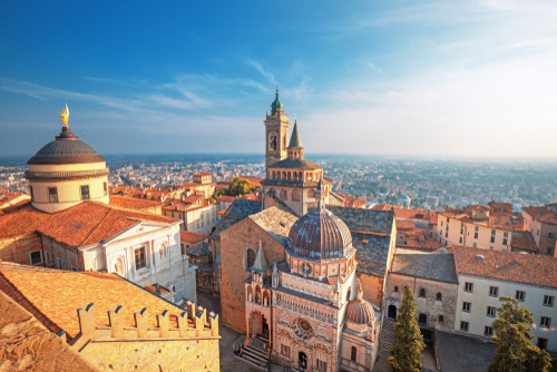 Bergamo, Lombardy, Italy. Scenic view of the old town city center and Basilica of Santa Maria Maggiore and Cappella Colleoni in Citta Alta. Landscape of the historical buildings during the sunset