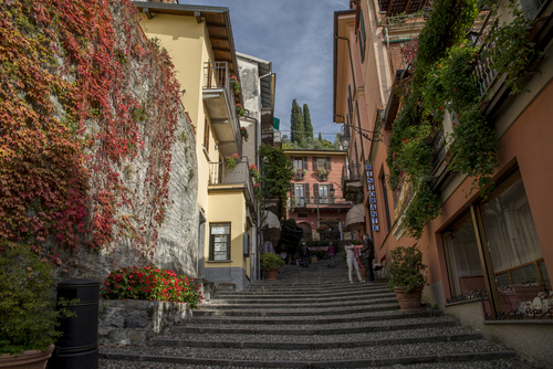 Autumn colors in picturesque street of Varenna town, Lake Como, Lombardy, Italy