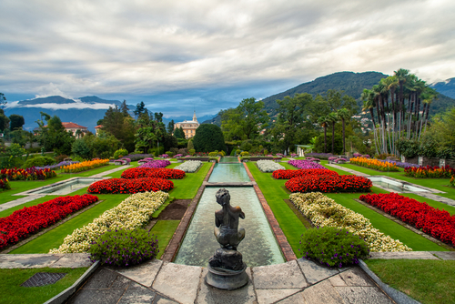 The botanical garden of Villa Taranto, Verbania, Lake Maggiore, Lombardy, Italy, with the fisherman sculpture