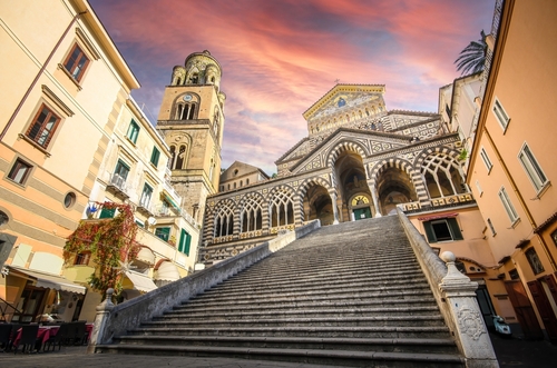 The Amalfi Cathedral bell tower in Amalfi, Amalfi Coast, Campania, Italy. The church of the Apostle Saint Andrew, Roman Catholic church in the Piazza del Duomo at sunset