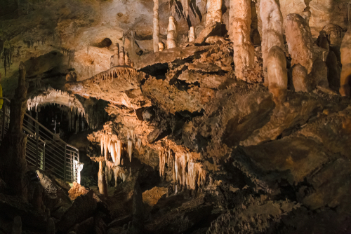 A footbridge allows you to visit the beautiful rock formations of the Antro del Monte Corchia cave in the Apuan Alps in Italy