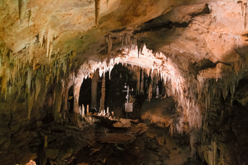 A footbridge allows you to visit the beautiful rock formations of the Antro del Monte Corchia cave in the Apuan Alps in Italy