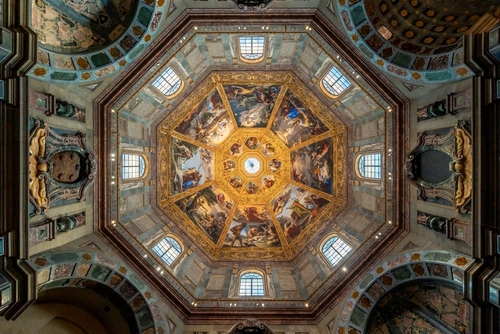 Bottom up symmetrical view of arches and ceiling of renaissance architecture in famous Cappelle Medicee of Basilica di San Lorenzo catholic cathedral in Florence, Tuscany, Italy