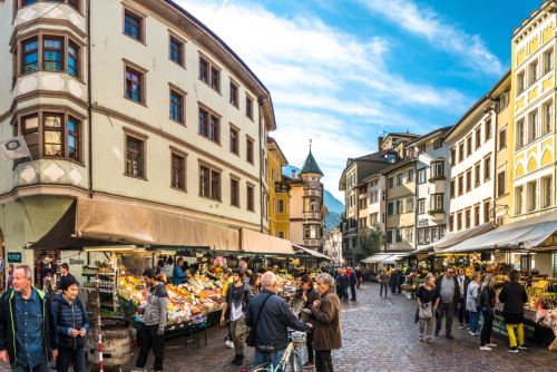 People shopping at a famous Market Square in the old town of Bolzano, Trentino Alto Adige, Italy