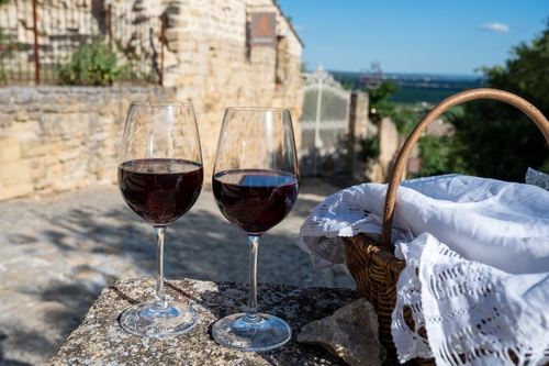 Wine tour with tasting of red dry wine and ruins of medieval castle of Châteauneuf-du-Pape ancient wine making village in Provence, France