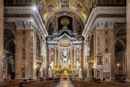 Inside and details of the Baroque church of Gesu Nuovo (Chiesa del Gesu Nuovo) in Naples, Campania, Italy