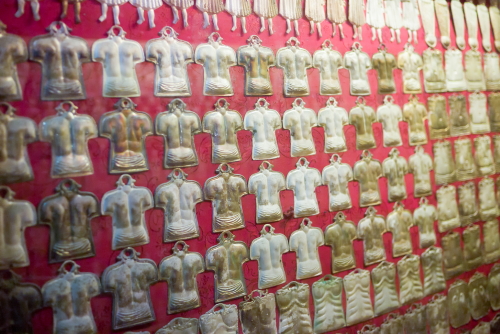 Many silver votives in the Baroque church of Gesu Nuovo (Chiesa del Gesu Nuovo) in Naples, Campania, Italy