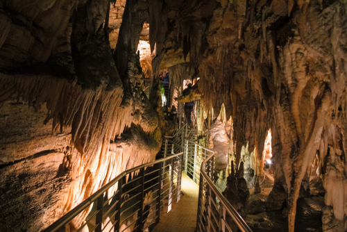 A footbridge allows you to visit the beautiful rock formations of the Antro del Monte Corchia cave in the Apuan Alps in Liguria, Cinque Terra, Italy
