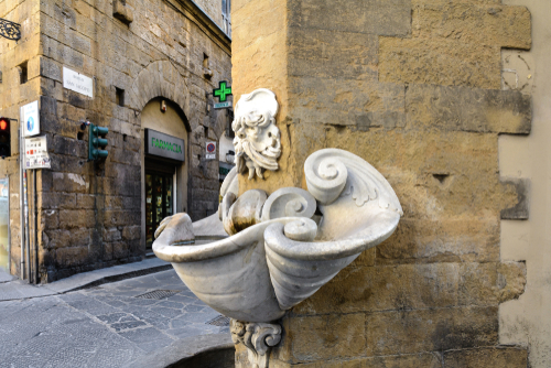 A fountain at the corner of the house at the intersection of Sprone and Borgo San Jacopo Streets. Architect and Sculptor Bernardo Buontalenti in Florence, Tuscany, Italy