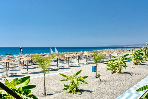 View of the beach and its facilities in Giardini Naxos, Naxos Beach hotel complex, Sicily, Italy