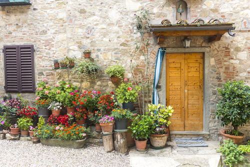 View of a house with may flower pots in Greve in the Chiani Classico region, Tuscany, Italy