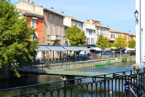 View on the river with bars and restaurants during touristic season, L'Isle sur la Sorgue, Provence, France