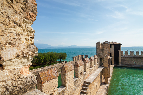 Sunny view of castle Rocca di Sirmione at Garda lake, Lombardy, Italy