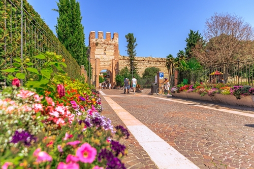 People walking around the beautiful and quaint city of Lazise, located at La Garda lake, Veneto, Northern Italy
