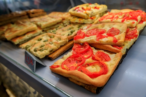 Selection of freshly made focaccia, traditional local flat bread at a restaurant in old town of Manarola in Cinque Terre on Mediterranean Sea, Liguria, Italy