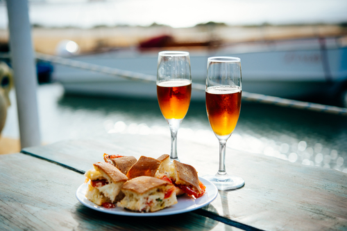 Marsala wine and typical Sicilian snacks are served for aperitivo in Marsala, Sicily, Italy