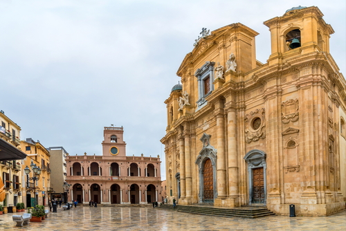 Day view of main square and Marsala Cathedral, started in 1628, was built on a Norman implant dated to 1176. Marsala, Sicily, Italy