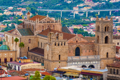 Exterior view of the Monreale Cathedral seen from the mountains that surround the town near Palermo, Sicily, Italy