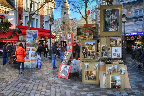 Bohemian painters painting in the Place du Tertre close of the Sacre Coeur of Montmartre in Paris, France