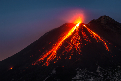Tallest active volcano of Europe 3329m in Italy. Splendid view Etna ruption at sunset, Sicily, Italy. Wonderful colors, lava flow red
