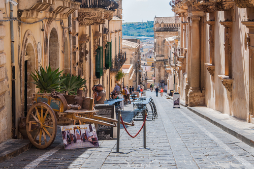 Traditional Sicilian cart on street in old city centre of Noto, Sicily, Italy. UNESCO World Heritage Site