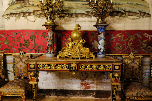Luxury table clocks and candlesticks in the interior of the house of a wealthy family, Palazzo Mirto in Palermo, Sicily, Italy
