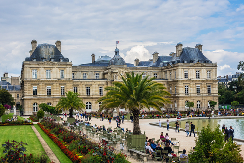 Tourists and Parisians relaxing in Luxembourg Garden (Jardin du Luxembourg), Paris, France, these gardens are the second largest public park in Paris