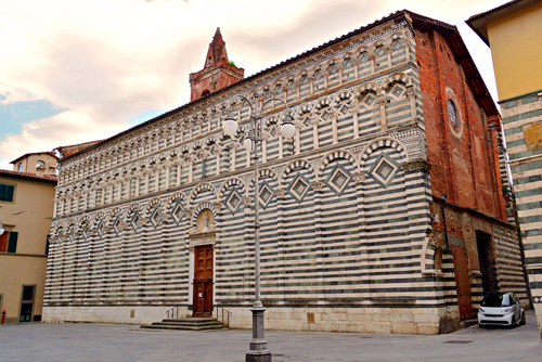 View of the marble side of the church of San Giovanni Fuorcivitas in the historic center of Pistoia in Tuscany, Italy