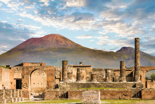 View of ruins in Pompeii with mount Vesuvius in the background near Naples, Campania, Italy