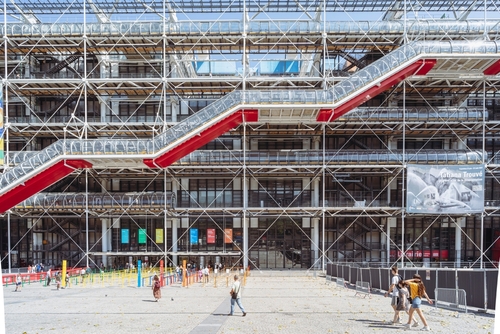 People walking around the Pompidou Center, Paris, France. The Centre Georges Pompidou is a complex building in the Beaubourg area of the 4th arrondissement of Paris